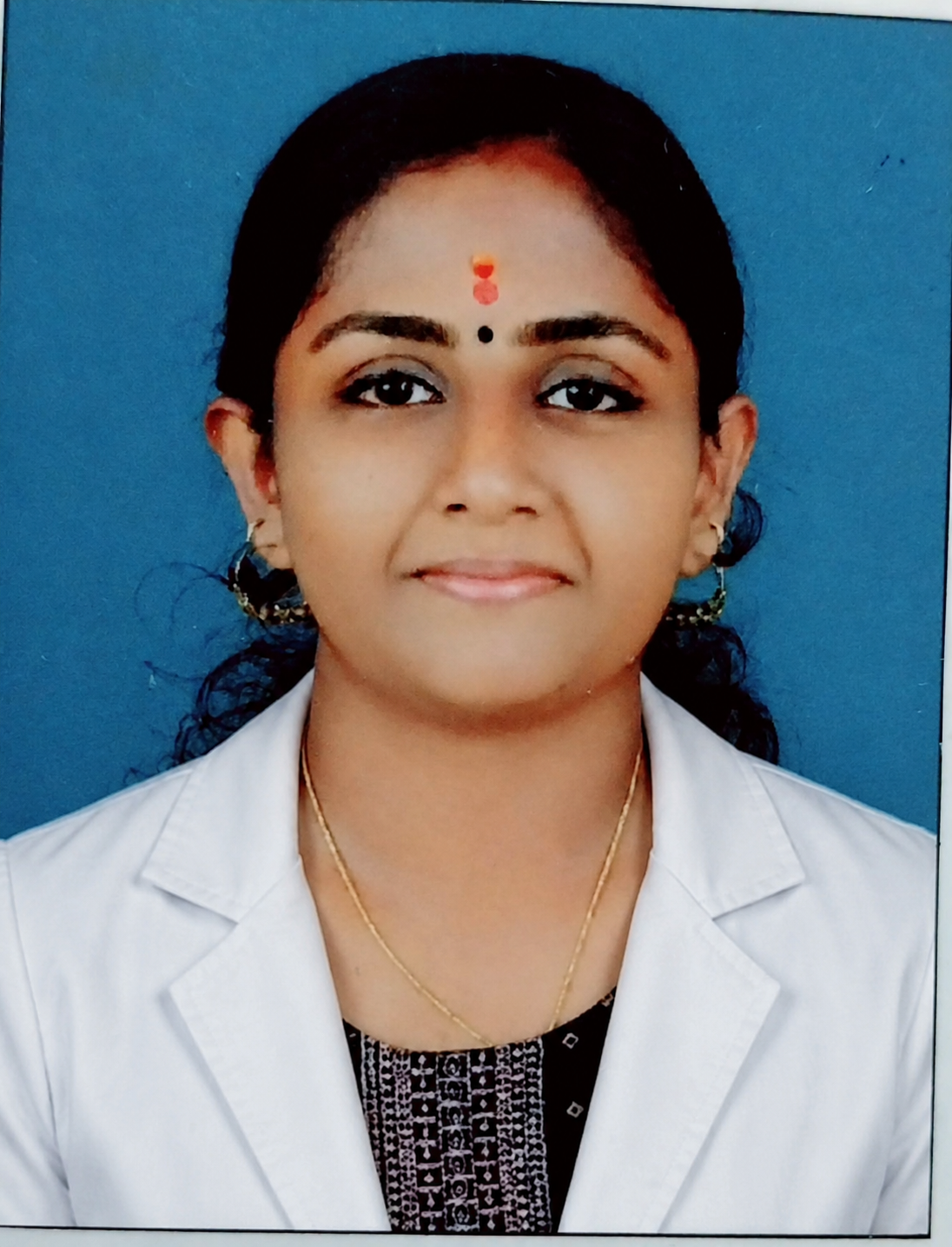 Dietitian in white lab coat - Clinical Nutritionist at My Joint Pain Doctor Clinic Thrissur